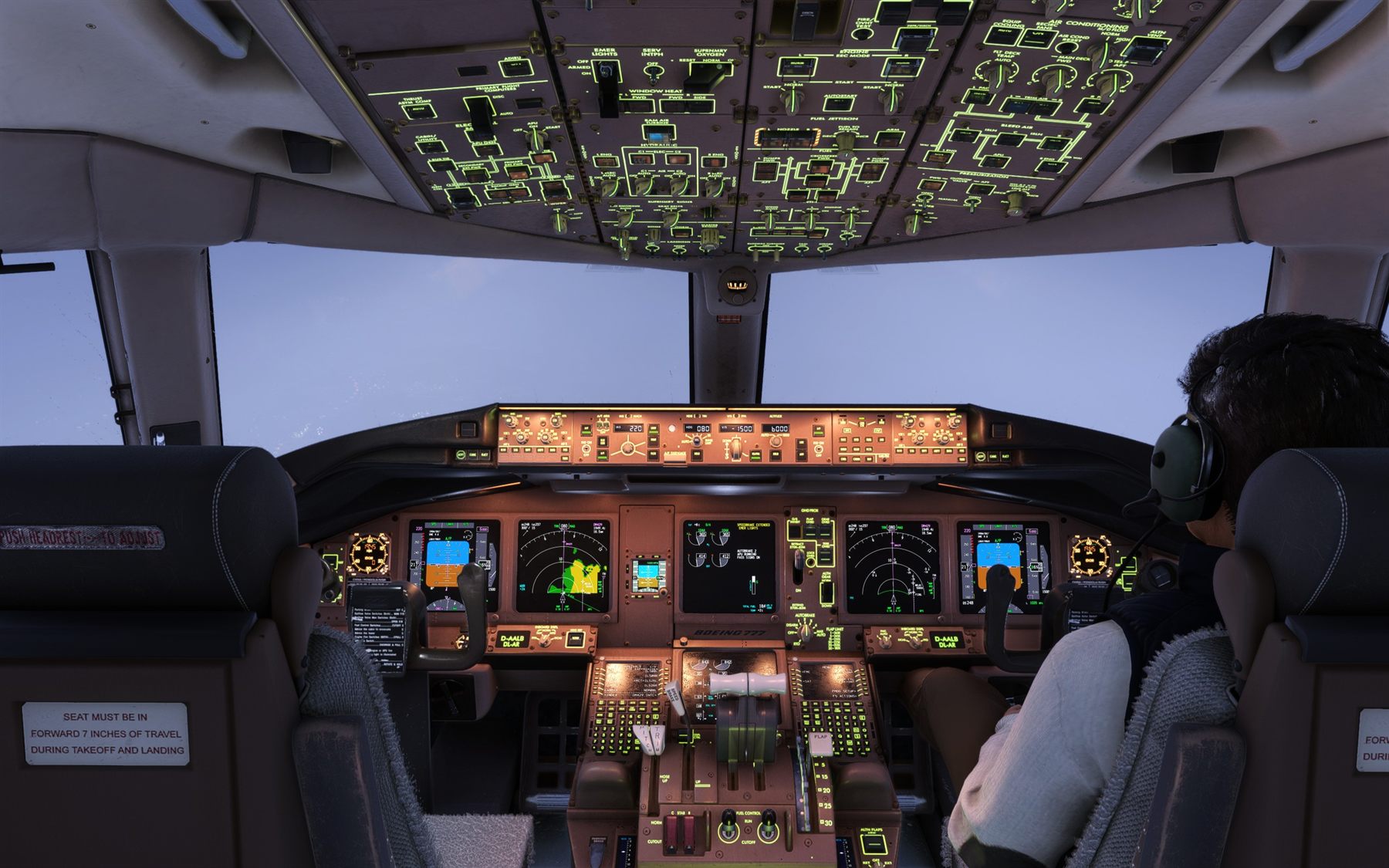 Boeing 777F flight deck on descent at dusk